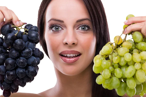 Young beautiful woman holding grapes — Stock Photo, Image