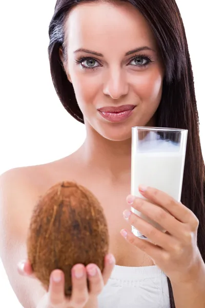 Woman with coconut and coconut milk — Stock Photo, Image