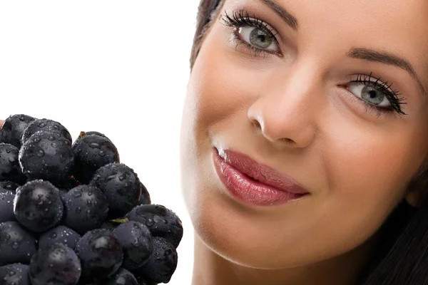 Woman and fresh grapes — Stock Photo, Image