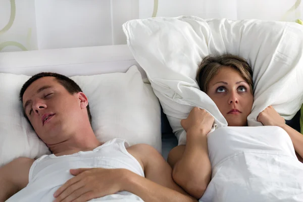 Snoring man and young woman — Stock Photo, Image