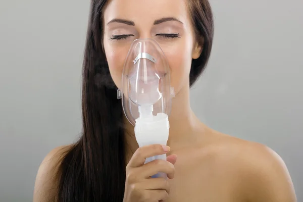 Woman keeping inhale mask — Stock Photo, Image