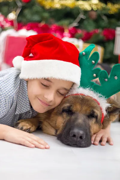 Boy and dog in Christmas night — Stock Photo, Image