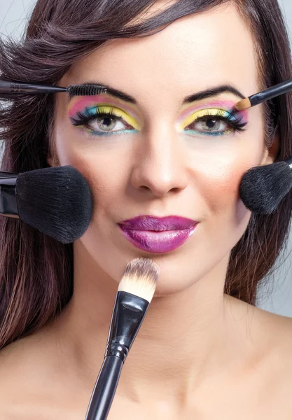 Beauty girl with makeup brushes — Stock Photo, Image