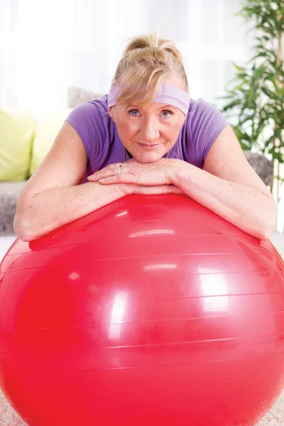 Senior woman after exercises relaxes — Stock Photo, Image