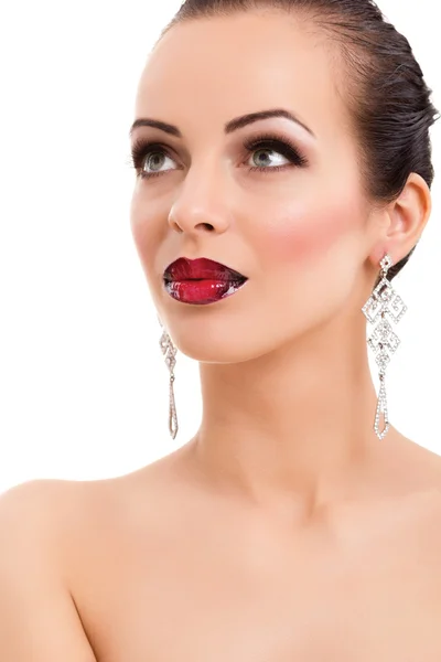 Beautiful young woman posing with bright red lips and jeweller — Stock Photo, Image