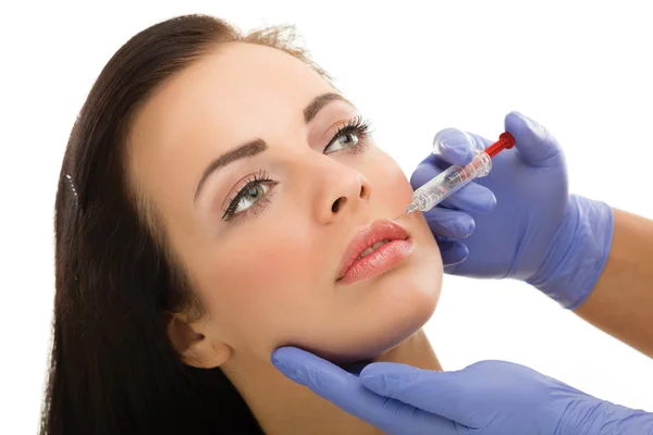 Botox skott i kvinnliga kinden — Stockfoto