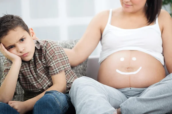 Young boy not happy about a new sibling — Stock Photo, Image