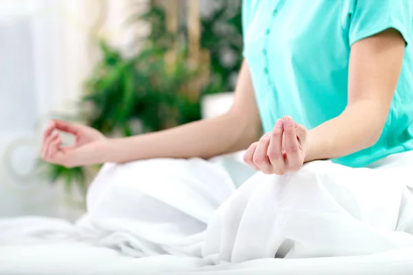 Close up portrait of a young woman in lotus position — Stock Photo, Image