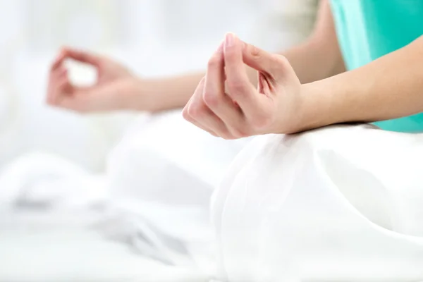 Close up portrait of a young woman in lotus position — Stock Photo, Image