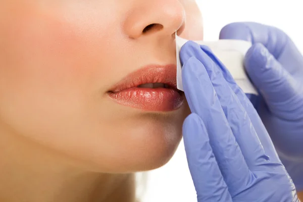 Woman reciving facial epilation — Stock Photo, Image