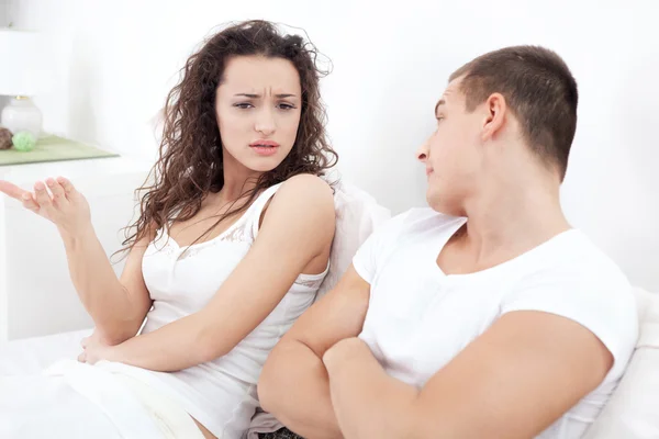 Portrait of unhappy young  couple in bedroom — Stock Photo, Image