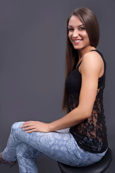 Beautiful elegant woman sitting on a chair — Stock Photo, Image