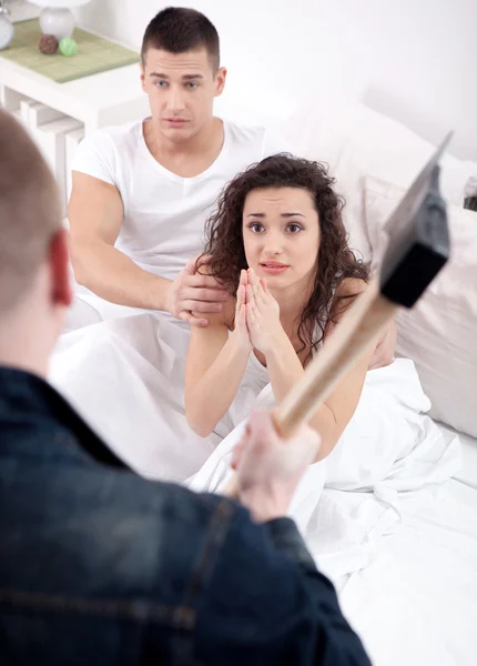 Angry husband with hatchet caught cheating wife with lover — Stock Photo, Image