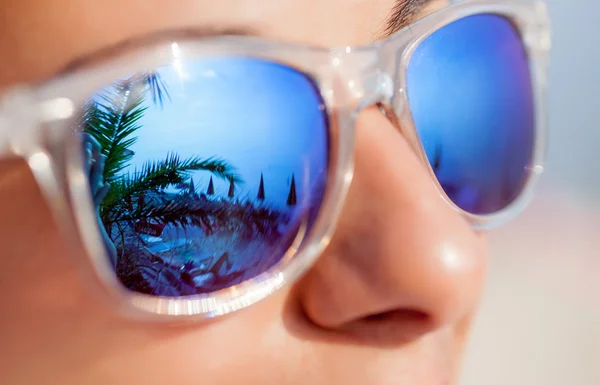 Close up of Woman In Sunglasses With Beach Reflection — Stock Photo, Image