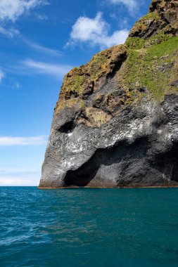 The Elephant Rock in Westman Islands. Basalt rock volcanic formation in Vestmannaeyjar, Iceland. clipart