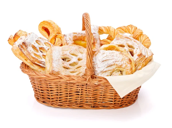 Sweet cakes in basket — Stock Photo, Image