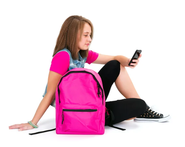 Mooie schoolmeisje met smartphone — Stockfoto