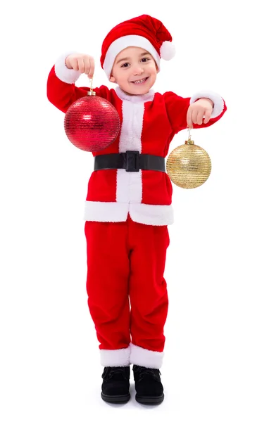 Little Santa Claus boy showing Christmas ornaments — Stock Photo, Image