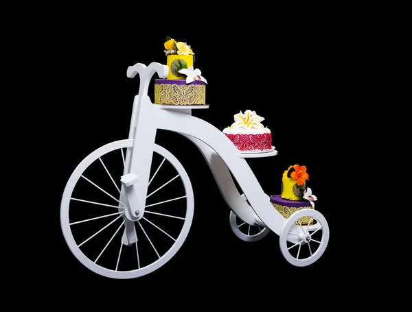 Unique bicycle cake stand with three cakes — Stock Photo, Image