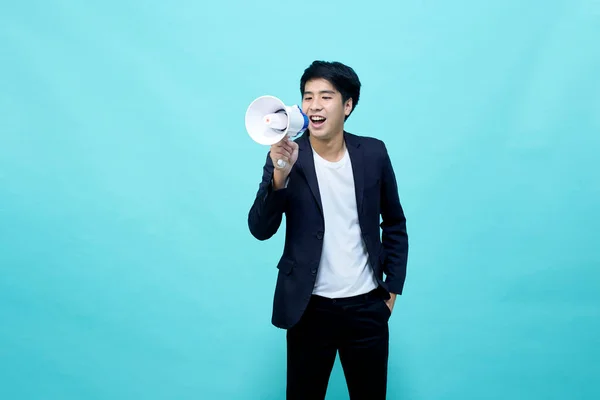 Asian Businessman Holding Megaphone Isolated Light Blue Background — Stok fotoğraf