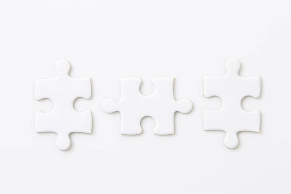 Three pieces of jigsaw used for business partner connection concept, white puzzle solution teamwork in success vision concept