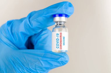 Coronavirus aşısı COVID-19 'un geliştirilmesi ve yaratılması. Coronavirus Aşı Kavanozu. Doktor Mavi Aşı Kavanozu. Aşı Coronavirus 'a karşı savaş kavramı.