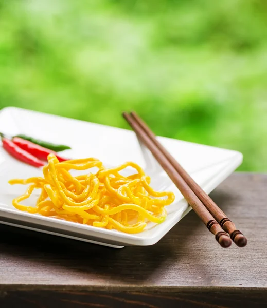 Egg noodles on nature background — Stock Photo, Image