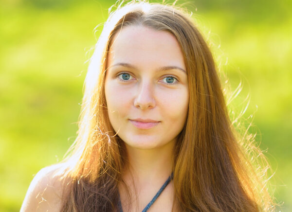 Portrait of young beautiful woman outdoors