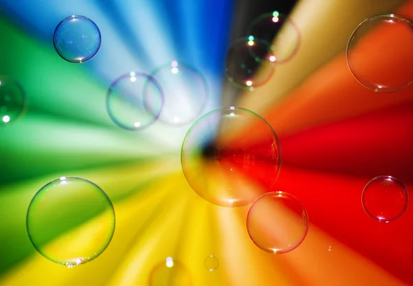 Soap bubbles and multi-coloured background — Stock Photo, Image