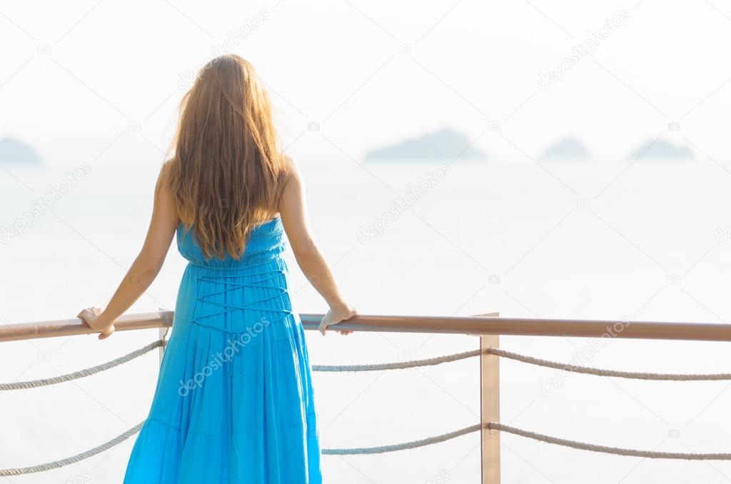 Young woman looking at the sea