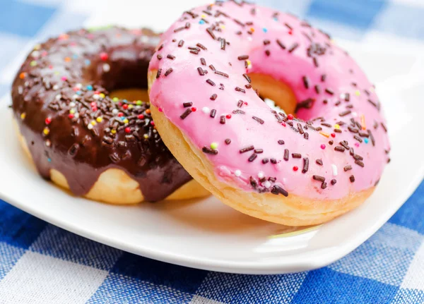 Fresh donuts on nature background — Stock Photo, Image