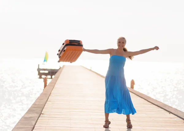 Young woman having fun on wooden pier — Stock Photo, Image