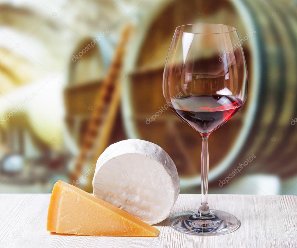 Glass of wine and cheese in winery