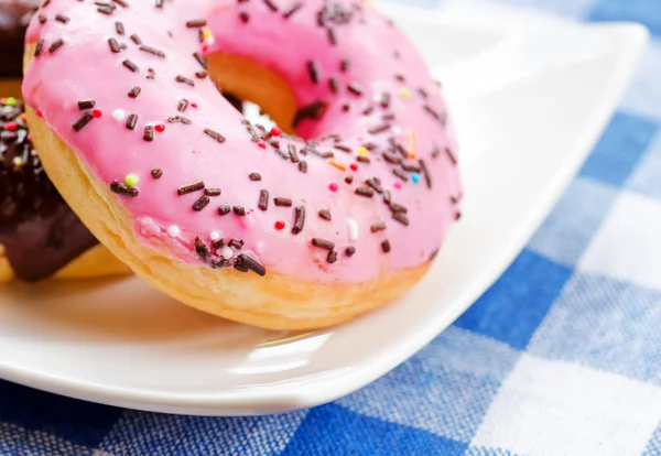 Fresh donuts on nature background — Stock Photo, Image