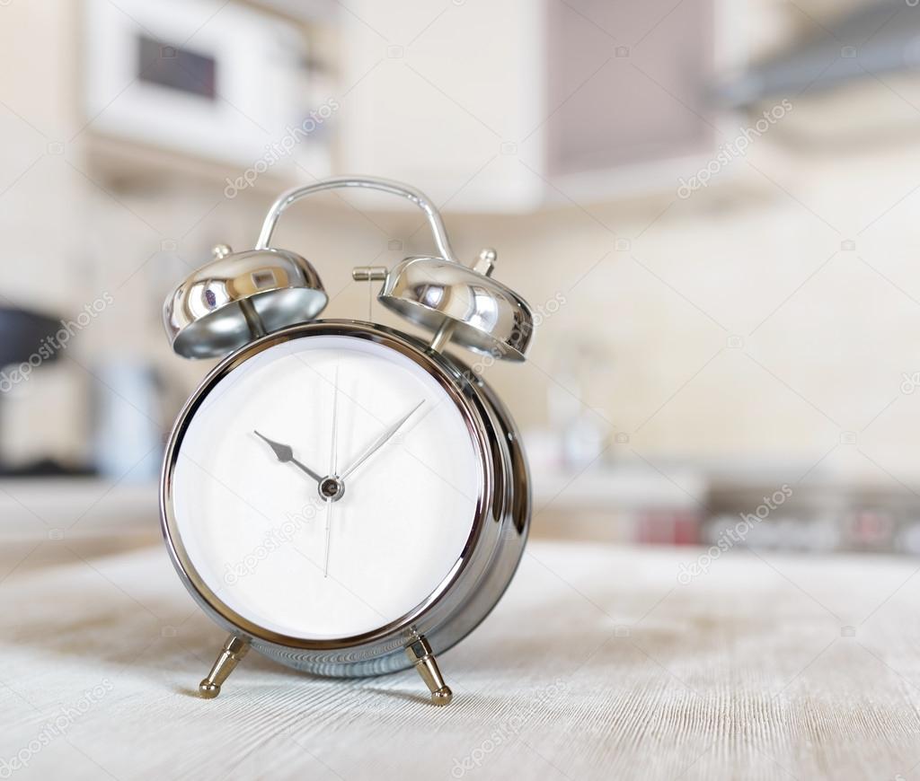 Alarm clock on a table in the kitchen