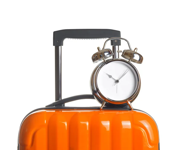 Alarm clock on orange suitcase — Stock Photo, Image