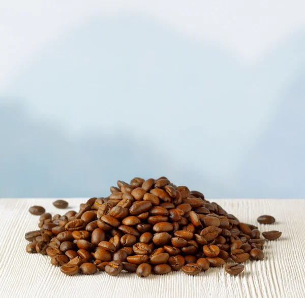 Coffee beans on highlands background — Stock Photo, Image