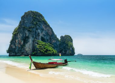 Boats on Phra Nang beach, Thailand clipart