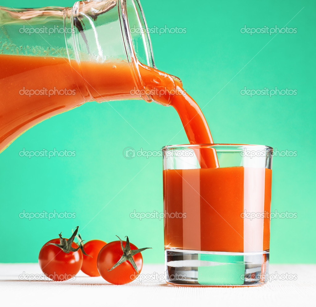 Tomato juice pouring from jug into a glass ⬇ Stock Photo, Image by © efired 39599753