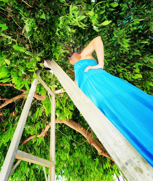 Young woman in a garden — Stock Photo, Image