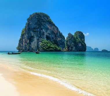 Clear water and blue sky. Phra Nang beach, Thailand clipart