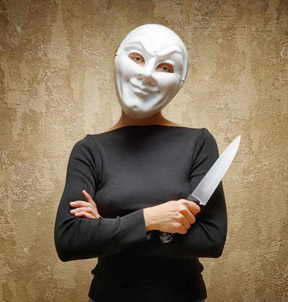 Woman in white mask holding the knife — Stock Photo, Image