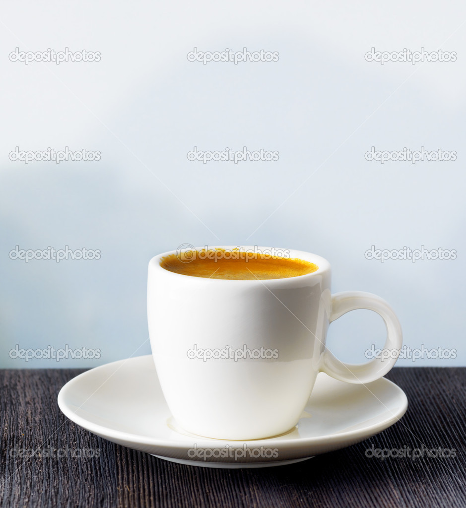 Cup of coffee on highlands background