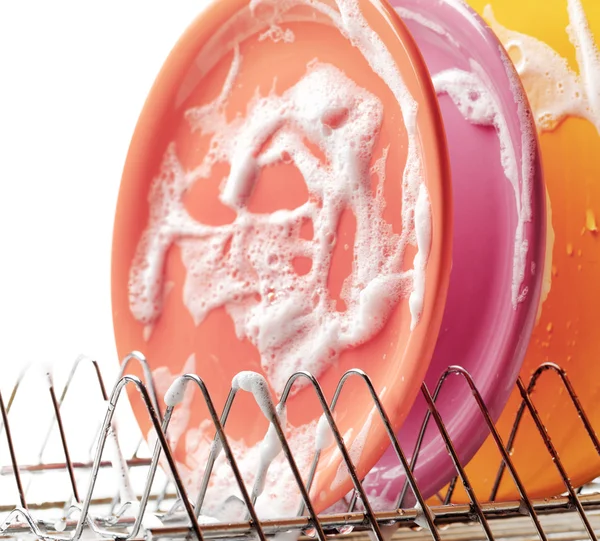 Plates with cleaning foam in dishwasher — Stock Photo, Image