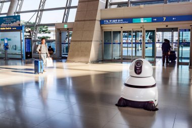 Seoul, South Korea - 16 October 2017: LG's airport cleaning robot in main hall of Incheon airport.  clipart