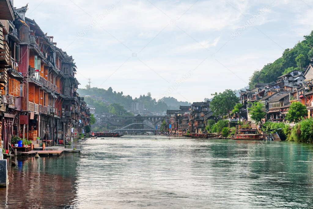 Awesome view of Phoenix Ancient Town (Fenghuang County) and the Tuojiang River (Tuo Jiang River) in China. Fenghuang is a popular tourist destination of Asia.
