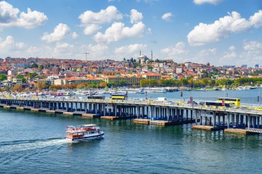 View of the Ataturk Bridge over the Golden Horn in Istanbul, Turkey. The Fatih Mosque is visible in background. Istanbul is a popular tourist destination of the world. clipart