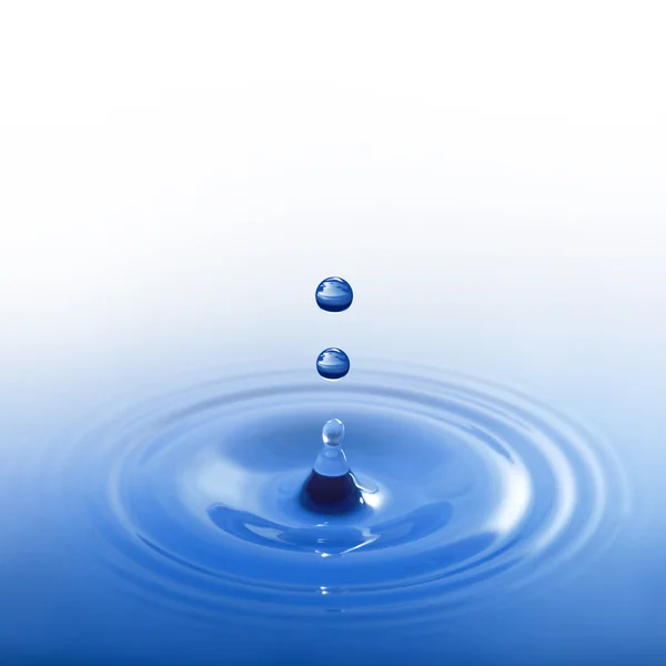 Blue water drop on white background Stock Image