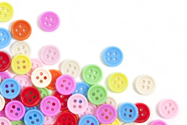 Multi color buttons on white background with copy space — Stock Photo, Image