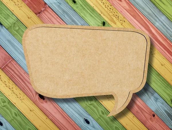 Blank Speech Bubble on colorful painting wood background — Stock Photo, Image